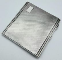 A Vintage Sterling Silver Cigarette Case. Machine tooled exterior decoration with a rich gilded