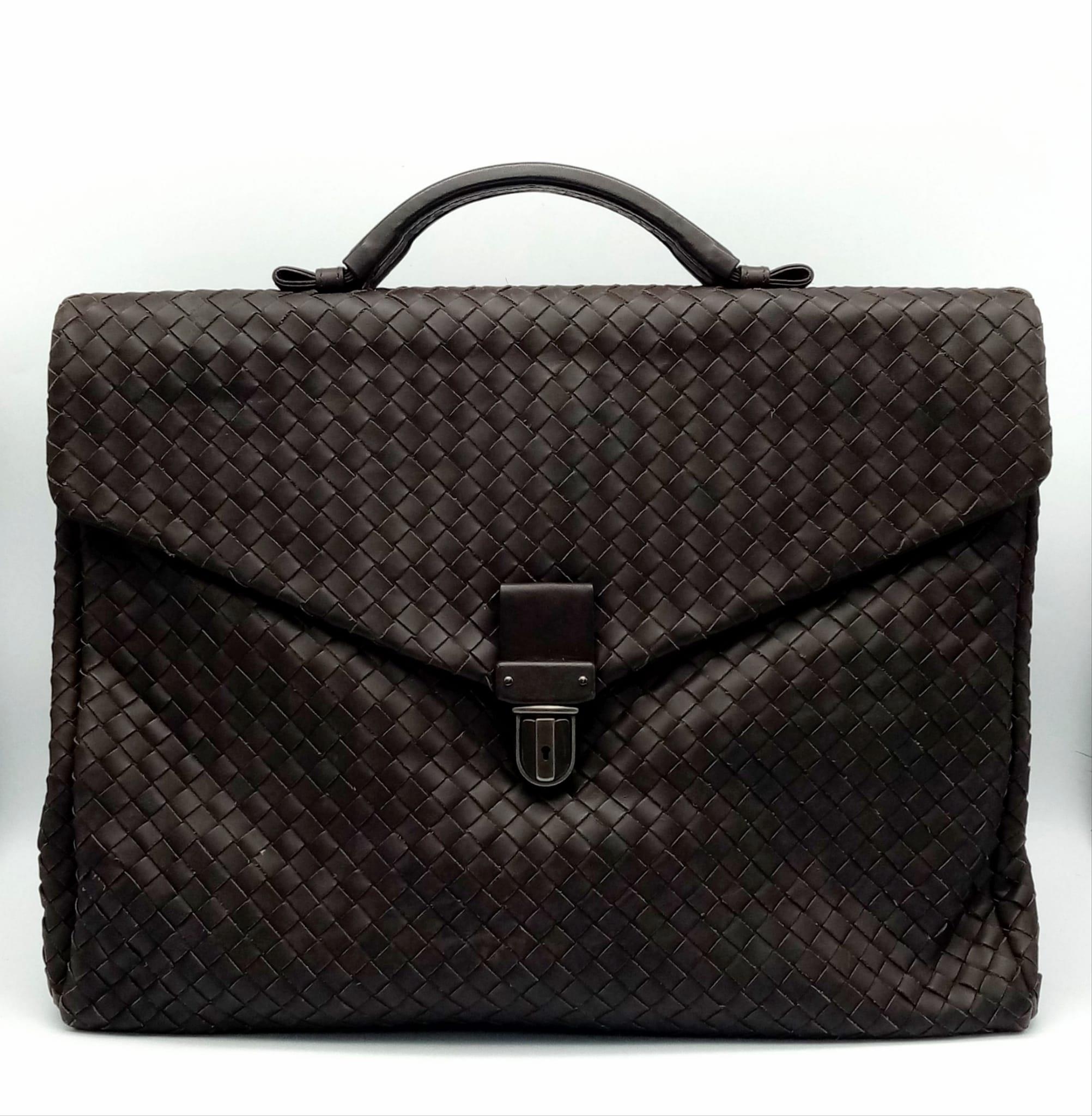 A Bottega Veneta Black Leather Briefcase. Leather intrecciato weave exterior with a large zipped