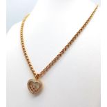 A Chopard 18K Yellow Gold and Floating Diamond Heart Pendant on an 18K Yellow Gold Belcher Link