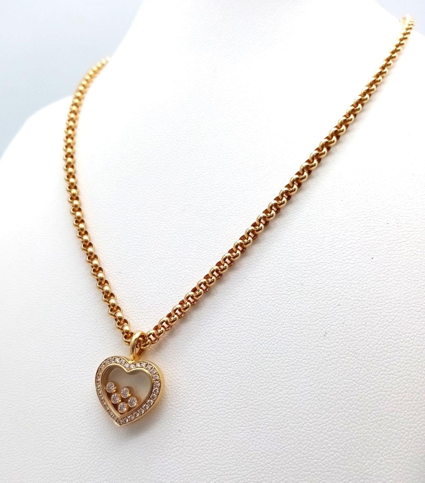 A Chopard 18K Yellow Gold and Floating Diamond Heart Pendant on an 18K Yellow Gold Belcher Link