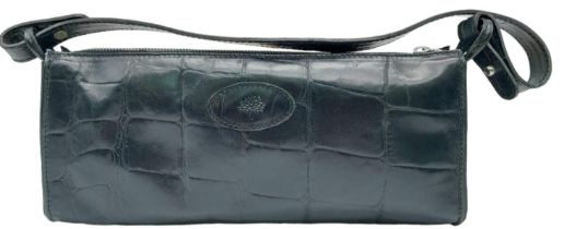 A Black Leather Mulberry Baguette Bag. Textured exterior with Mulberry logo. Decorative textile