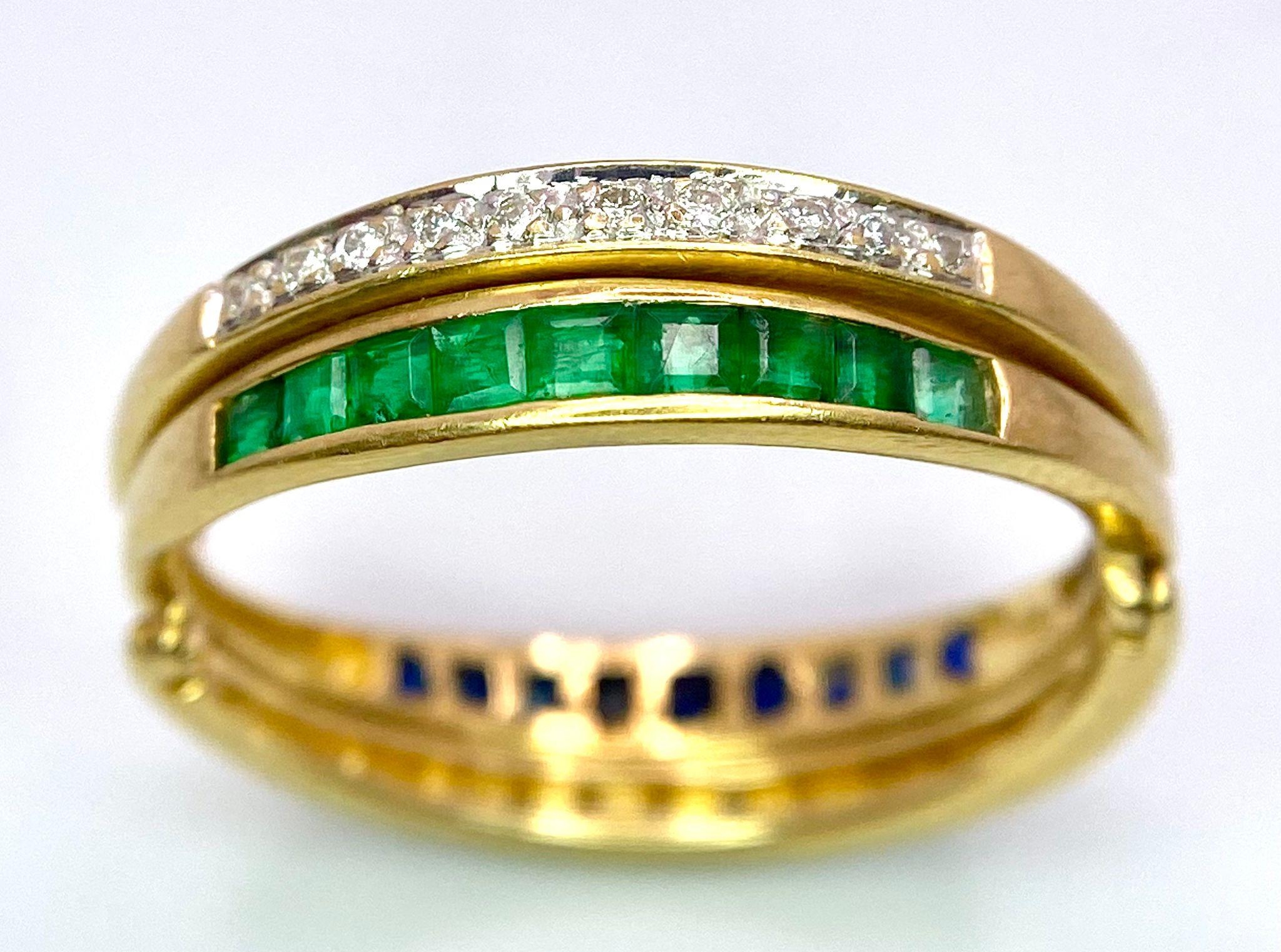 A very interesting 18 K yellow gold ring with two emerald bars and two rotating diamond bars that