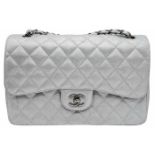 A Chanel Metallic Silver Double Flap Jumbo Bag. Quilted caviar leather. Silver tone hardware. Double