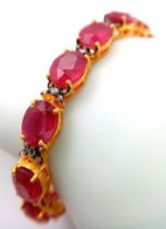 An Oval Cut Ruby and Diamond Gemstone Tennis Bracelet set in Gold Plated 925 Silver. 50ctw Rubies