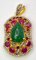 An Emerald, Ruby and Diamond Shield Pendant set in Gold Plated 925 Silver. A central 8ct teardrop