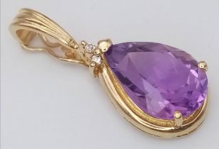 AN AMETHYST PENDANT SET IN 14K GOLD . 2.7gms