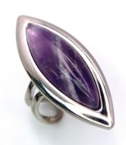 A Vintage Sterling Silver Modernist Design Amethyst Set Ring Size P (Adjustable). Set with a 3cm