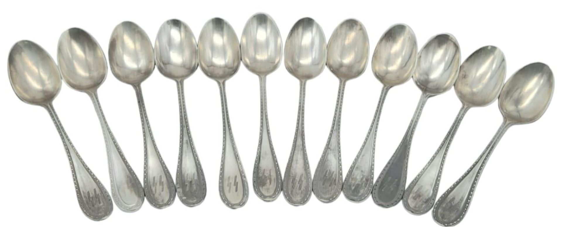 3rd Reich Waffen SS Set of 12 Silver Spoons with makers mark one the bowls. Tested as .800 Silver.