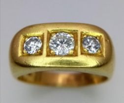 An 18K Yellow Gold Diamond Trilogy Gents Ring. Three brilliant round cut diamonds. 1ctw diamonds.