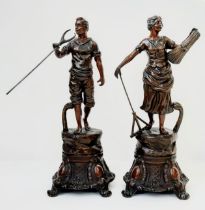 A charming pair of Victorian Smelted Bronze Statues. Both workers, this man & woman have spent the