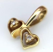 A 18K YELLOW GOLD DIAMOND SET DOUBLE HEART CHARM / PENDANT approx 1.12G 12mm x 10mm ref: SC 1081