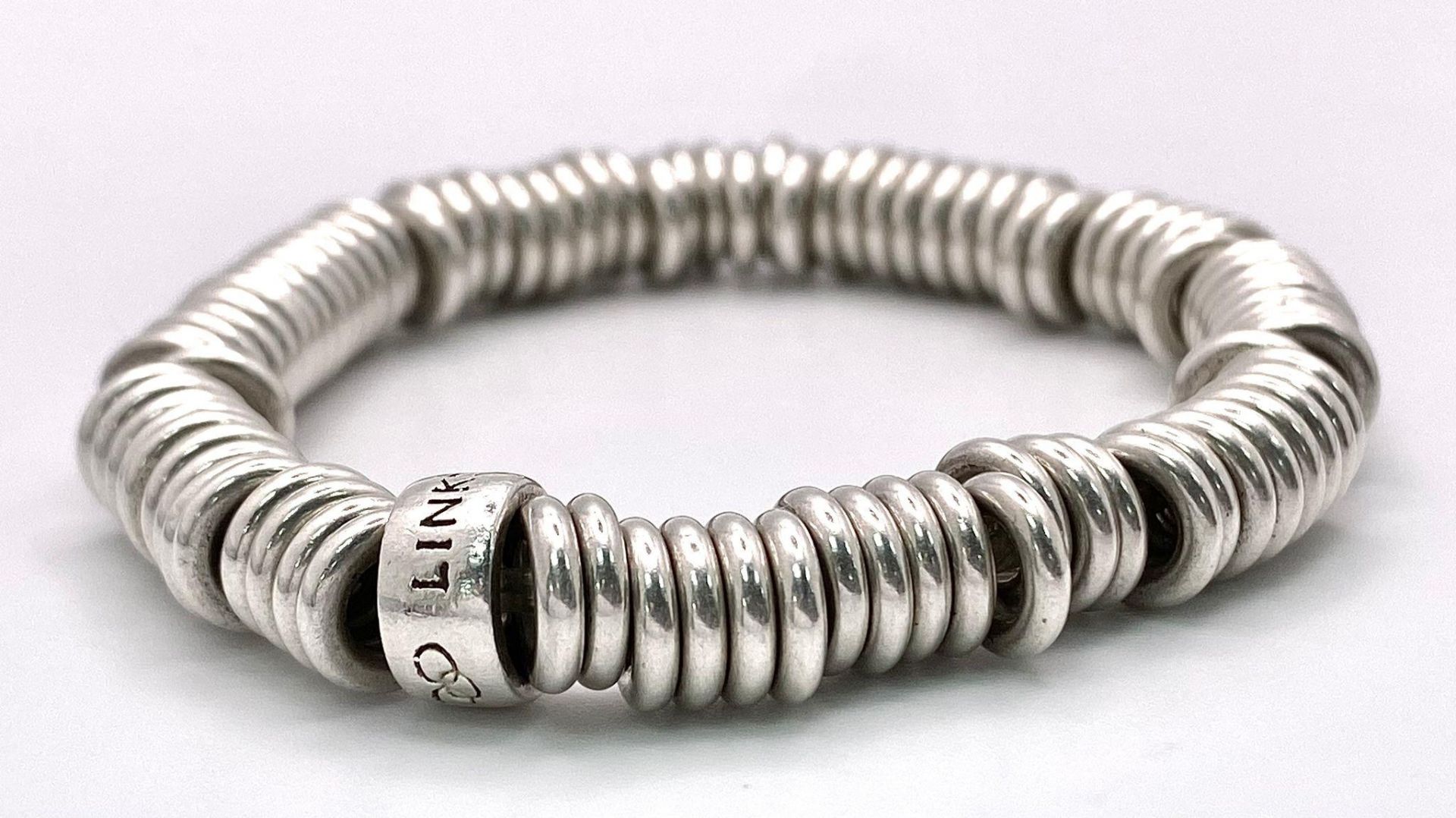 A silver Links of London adjustable bracelet. Total weight 53.53G.