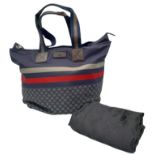 A Gucci Navy 'Diamante' Bag. Textile exterior with brown leather features, two textile and leather