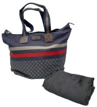 A Gucci Navy 'Diamante' Bag. Textile exterior with brown leather features, two textile and leather