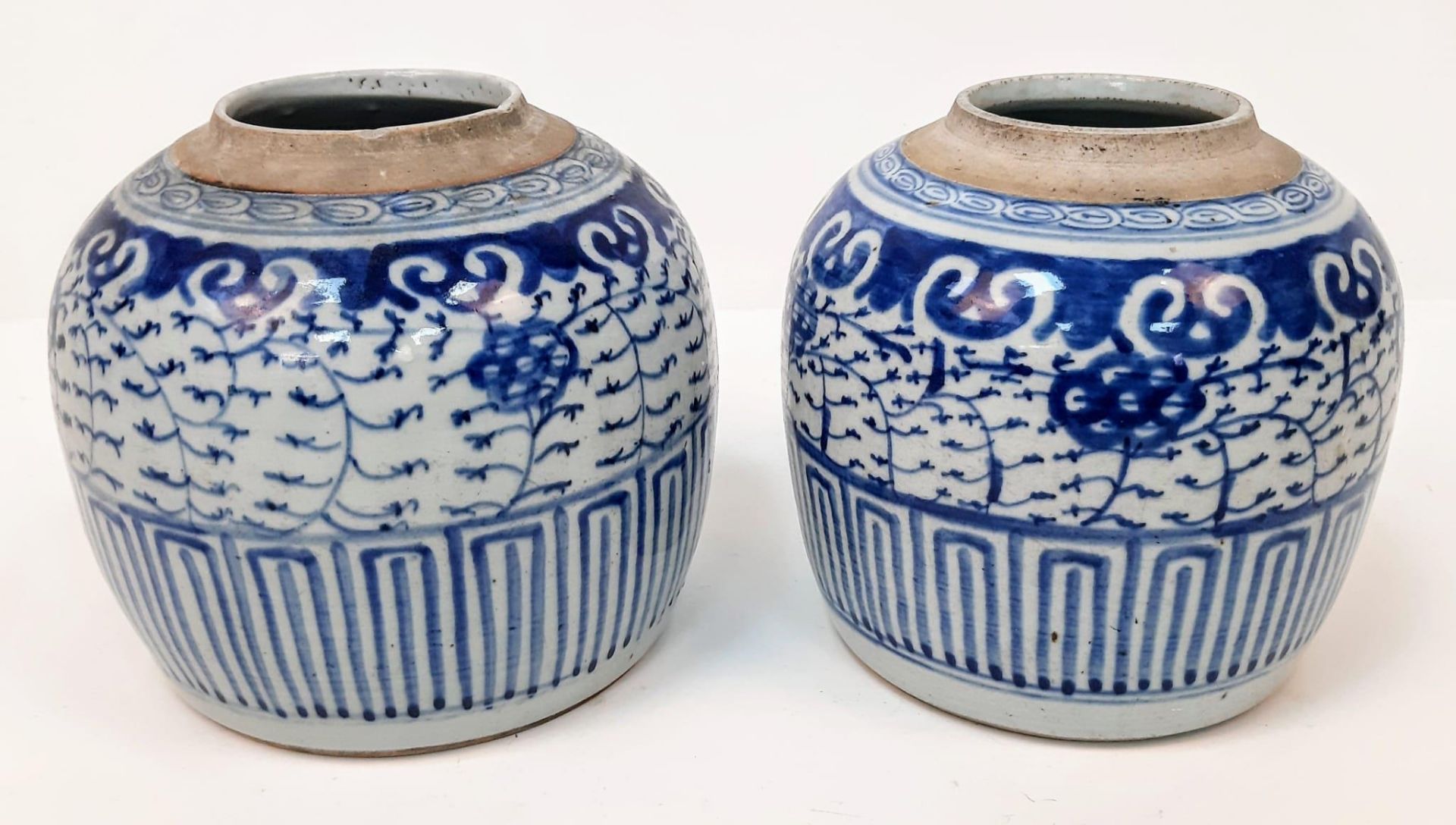 A PAIR OF LATE 19TH CENTURY BLEU GLAZED CHINESE POTS . 20cms TALL 22cms WIDTH (small chips at rim)