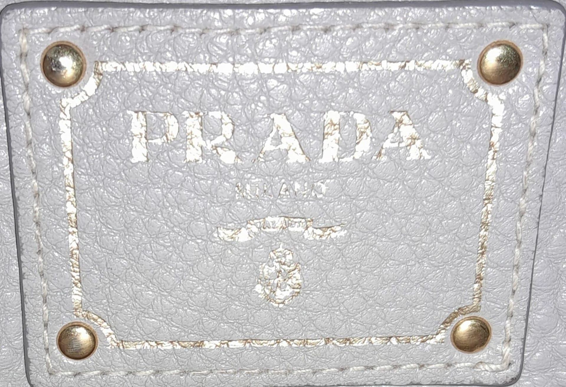A Prada Vitello Daino Tote Pomice Bag. Textured leather exterior with gold-tone hardware. Decorative - Image 7 of 9