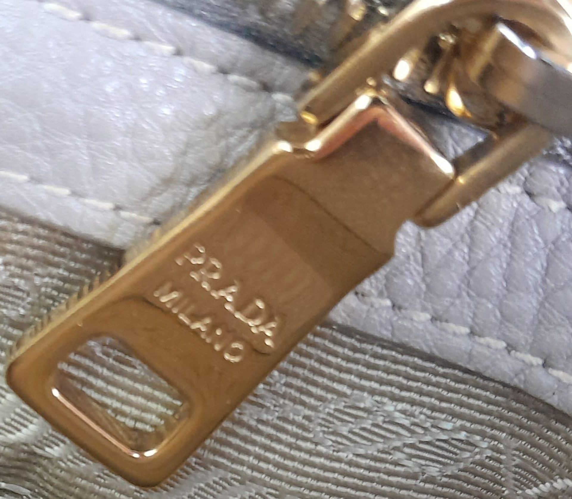 A Prada Vitello Daino Tote Pomice Bag. Textured leather exterior with gold-tone hardware. Decorative - Image 8 of 9