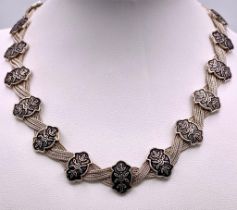 A Sterling silver floral collar necklace, 65g, approx 39.8cm length. ref: SH8110H