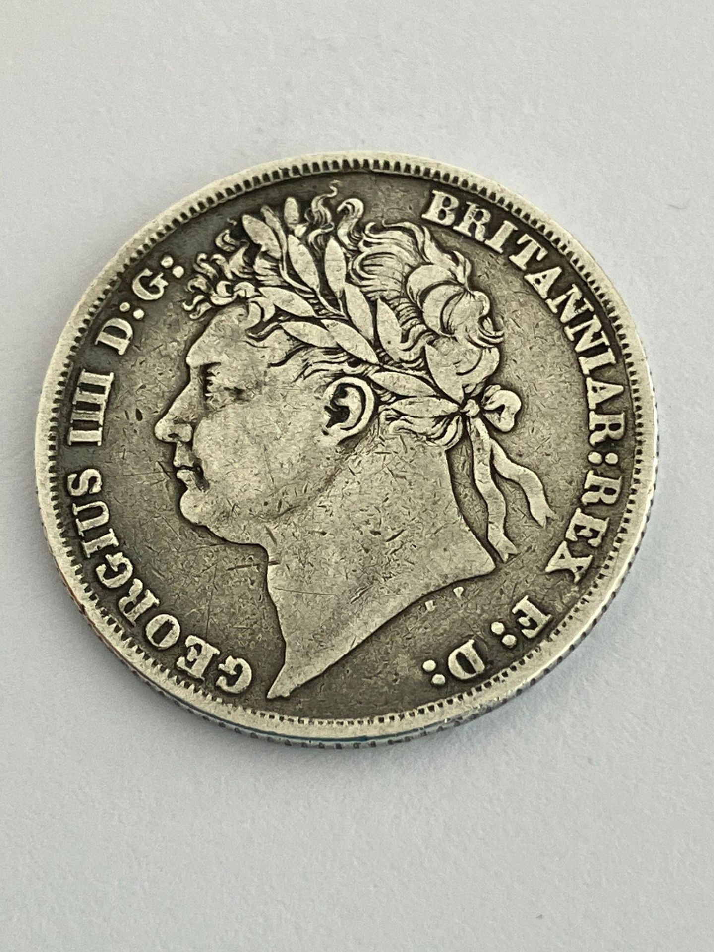1824 GEORGE IV SILVER SHILLING. Overall condition fine or better, with clear detail to both sides.
