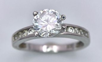 Stunning Sterling Silver, Round-Cut Cubic Zirconia Ring. Multiple stones accompany on the