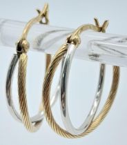 A Pair of 9K Yellow and White Gold Double Hoop Earrings. 1.57g weight.