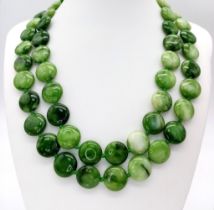 A Pretty Two-Row Green and White Jade Coin Bead Necklace. 14mm beads. 44cm length