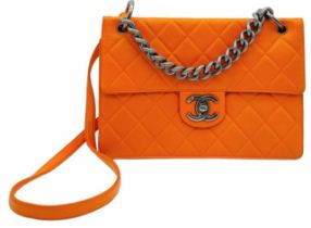 A Chanel Quilted Orange Caviar Leather Shoulder Bag. Quilted pattern exterior with gunmetal