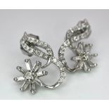 A PAIR OF 9K WHITE GOLD FANCY DIAMOND SET SWIRL EARRINGS. 0.40ctw, 2.4g total weight. Ref: SC1136