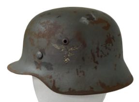 A 3rd Reich Double Decal M35 Helmet with early Droptail Eagle Decal.