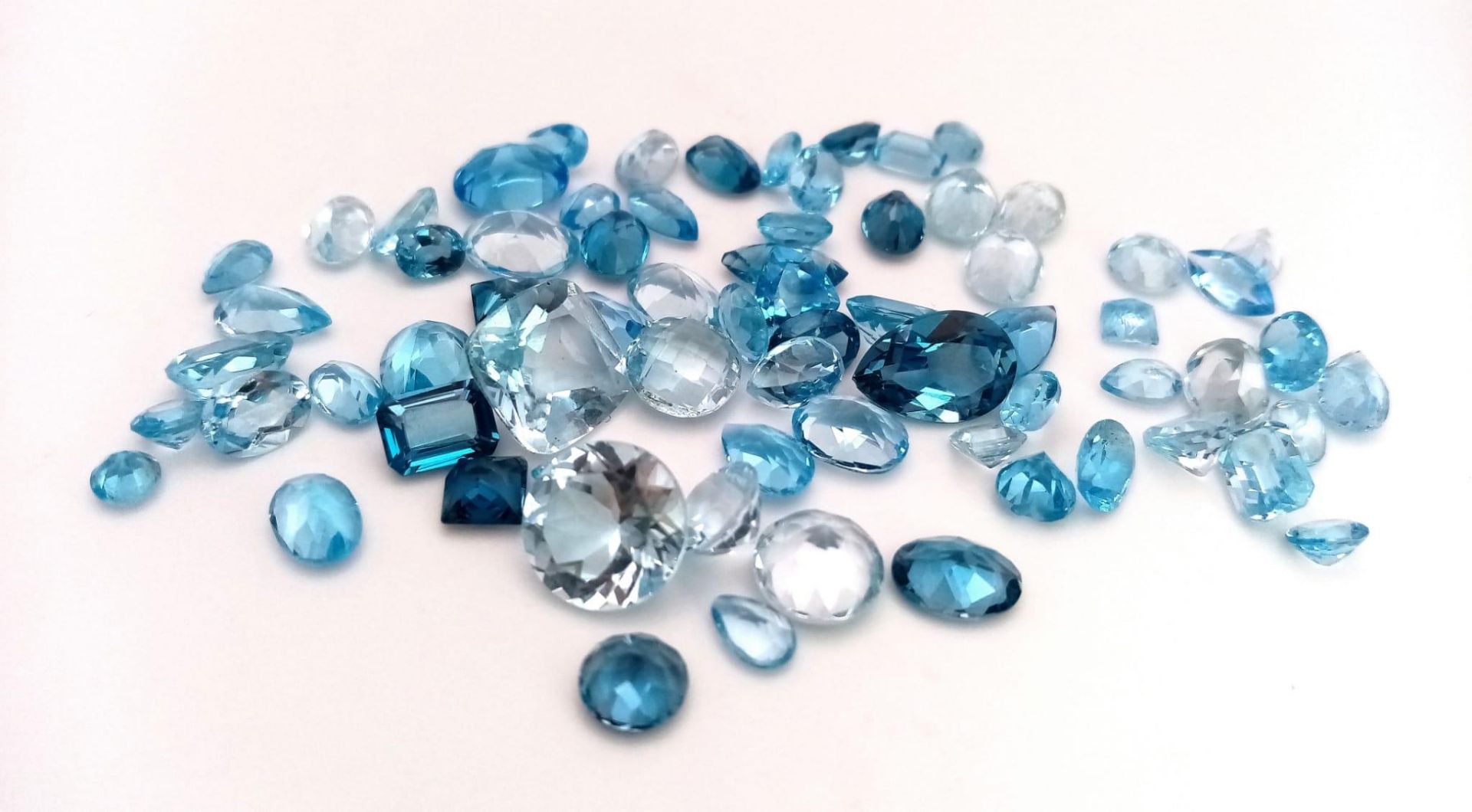A 78.25ct Blue Topaz Gemstone Lot Mixed Shapes Eye Clean
