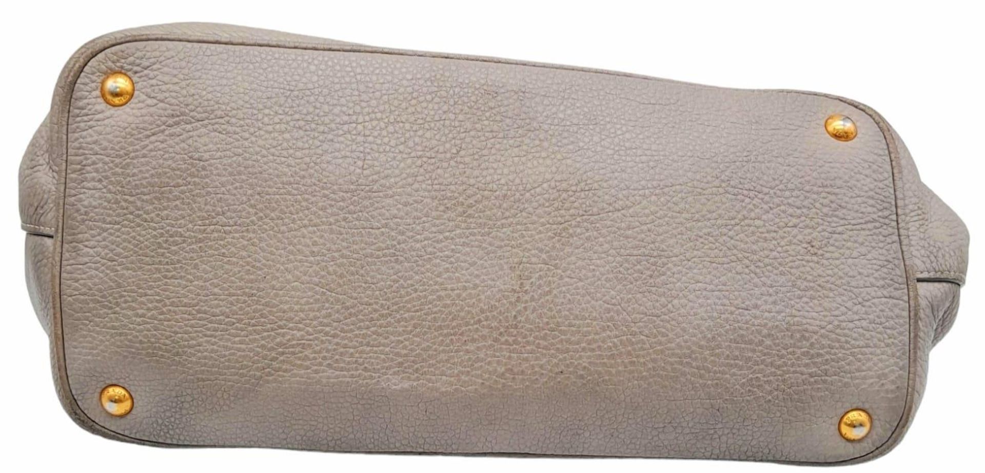 A Prada Vitello Daino Tote Pomice Bag. Textured leather exterior with gold-tone hardware. Decorative - Image 4 of 9