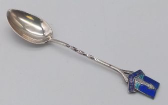 An antique sterling silver decorative tea spoon with enamel on handle. Full hallmarks Birmingham,