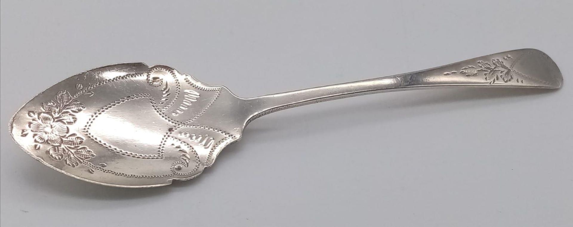 An antique sterling silver luxurious dessert spoon. Full hallmarks Sheffield, 1901. Total weight