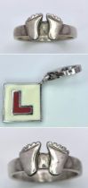 Two sterling silver "feet" rings and an "L Plate" charm/pendant, Rings size: L & Q, total weight: