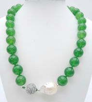 A Gorgeous Green Jade Bead Necklace with a Large Keshi Baroque Pearl Interrupter. Beads - 14mm.