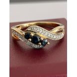 Beautiful DIAMOND and SAPPHIRE CROSSOVER RING set in 9 carat YELLOW GOLD With full UK hallmark. 2.66