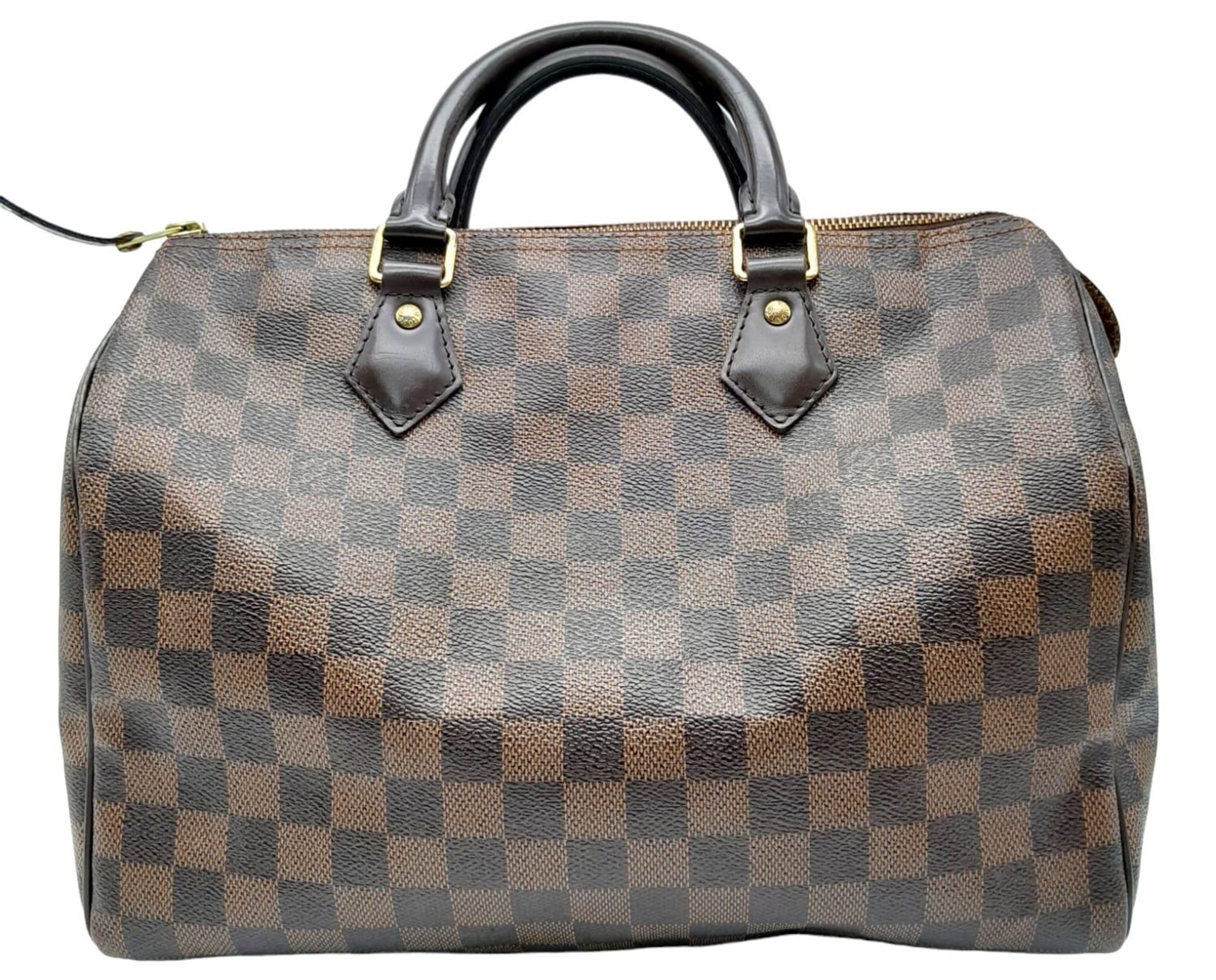 A Louis Vuitton Speedy Bag. Checked LV canvas exterior. Red textile interior. Comes with dust cover, - Image 3 of 12
