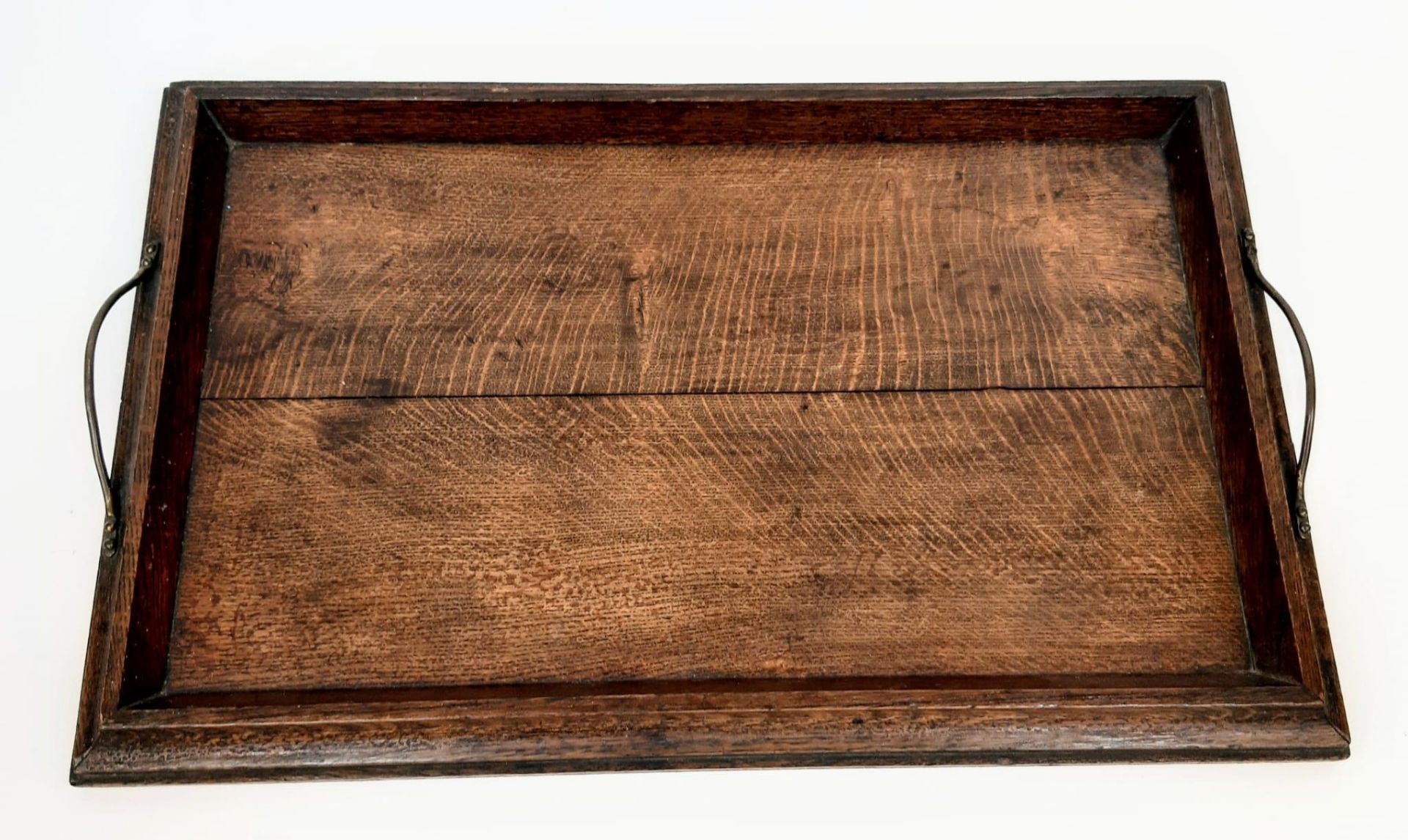 A good honest piece of Victoriana. An antique, solid oak, serving tray with bronze handles.
