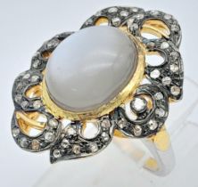 A Silver Gilt Oval Cabochon Moonstone and Rose-Cut Diamond Ornate Ring. Moonstone - 5.05ct. Diamonds