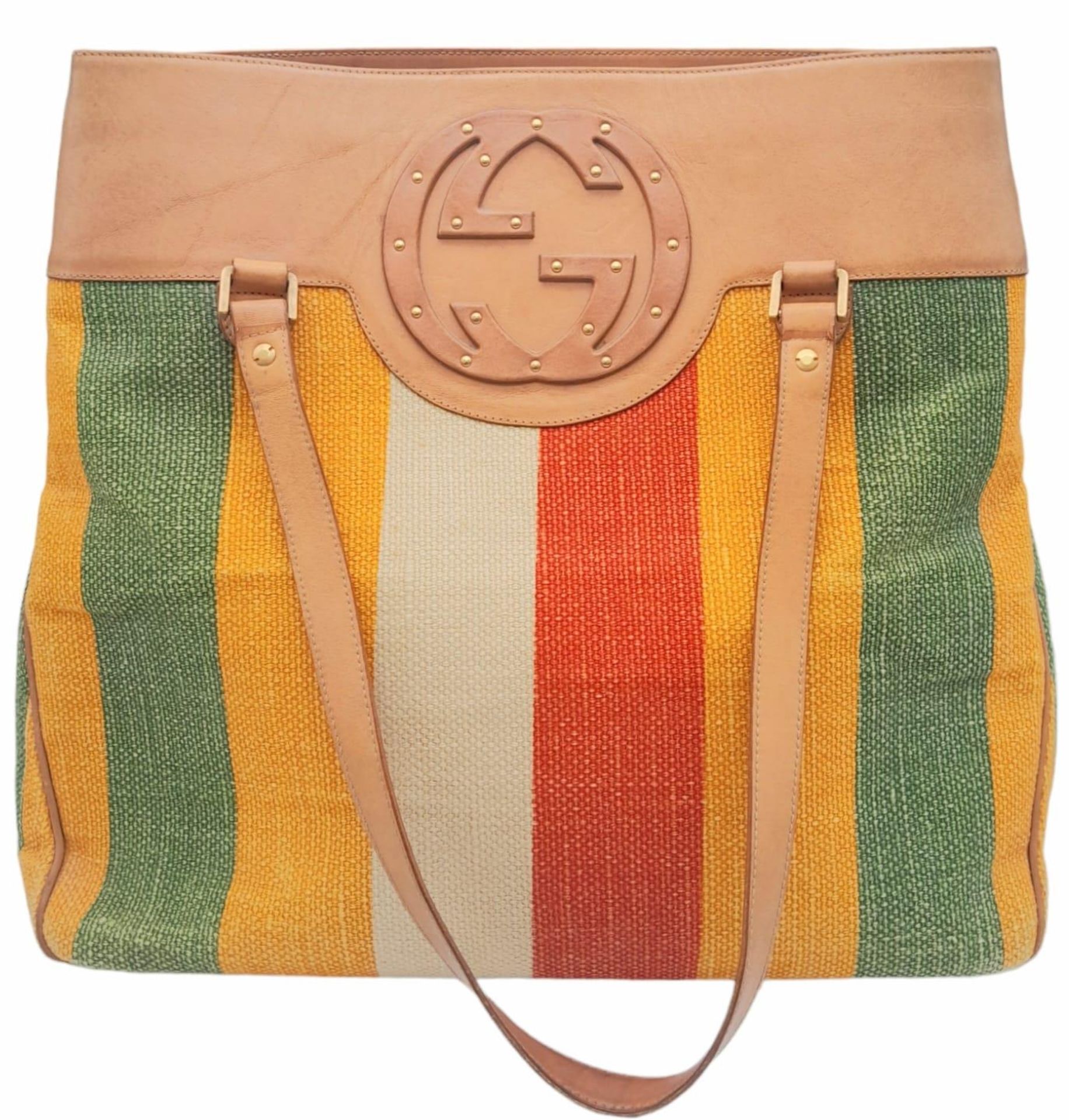 A Gucci Baiadera Canvas and Leather Tote Bag. Multi coloured canvas exterior with a large Gucci