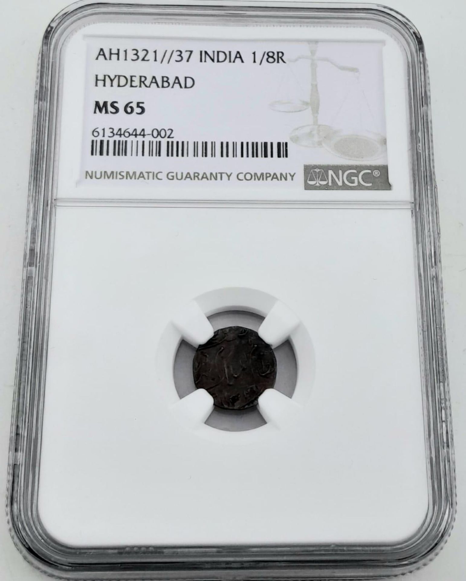 An NGC 1889 Indian 1/8 Rupee Silver Coin - Hyderabad Mint. Comes in a protective hard plastic wallet