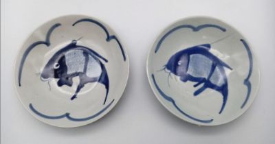 A pair of Chinese 1920's hand-painted bowls. Both marked on the bottom, measure 19cm wide and with a