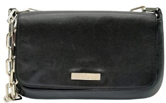 A Gucci Black Leather Flap Hand Bag. Silver-tone hardware. Black textile interior with zipped