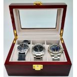 A Parcel of Three Men’s Watches Contained in a Piano Wood Finish Three Watch Travel Display Case.