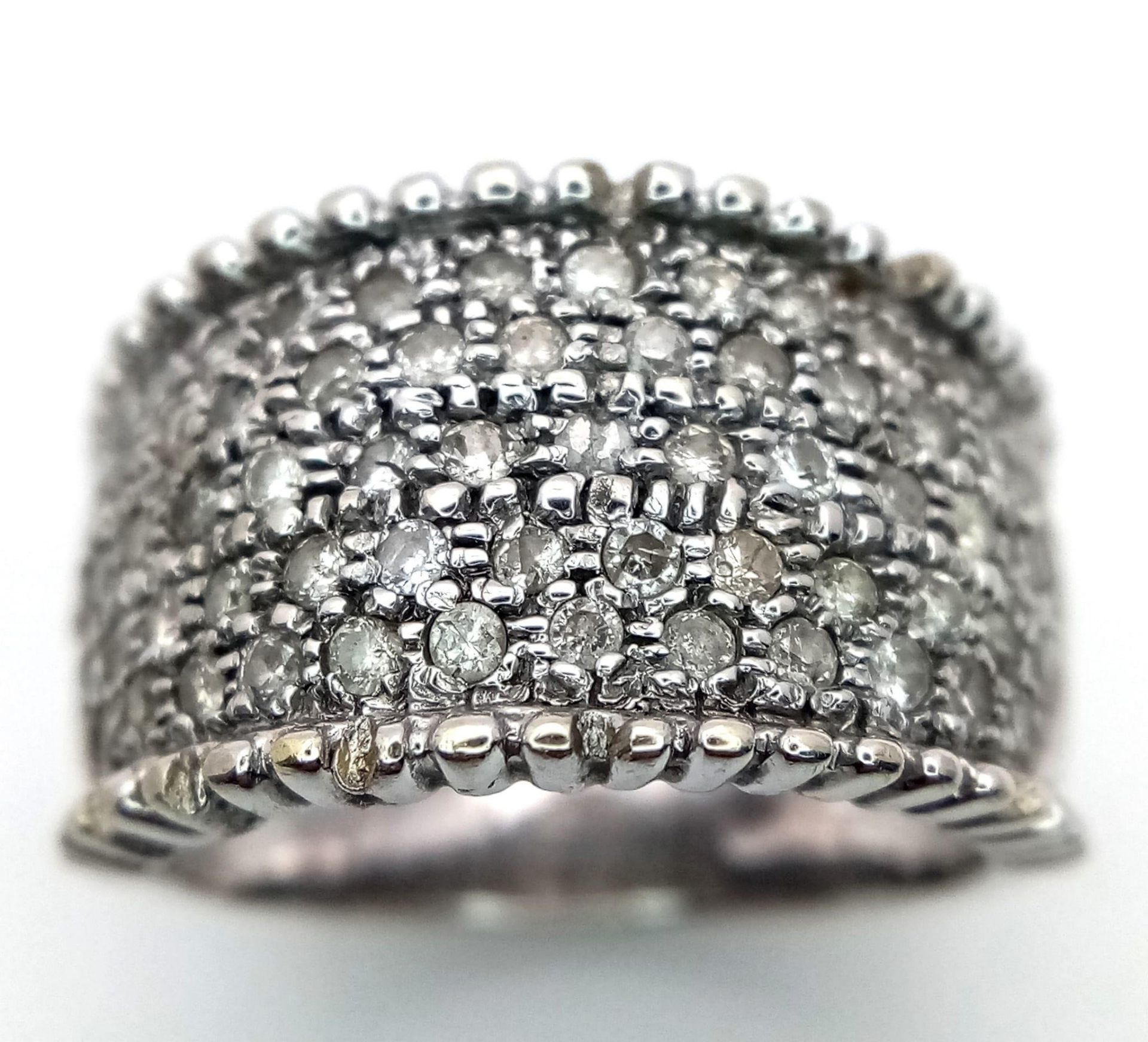 A 18K WHITE GOLD DIAMOND ENCRUSTED BAND RING 0.75CT 10.1G SIZE M 1/22 ref: 6538