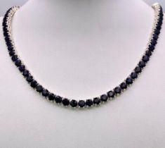 A Blue Sapphire Gemstone Tennis Necklace set in 925 Silver. 45cm length. 40.15g total weight.