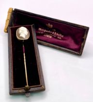 An Antique Mid-Carat Gold Cameo Mourning Stick-Pin. 7.5cm. 4.67g total weight. Comes with original