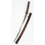 A WW2 Japanese Officers Sword with an ancient family blade. A veteran bring back.
