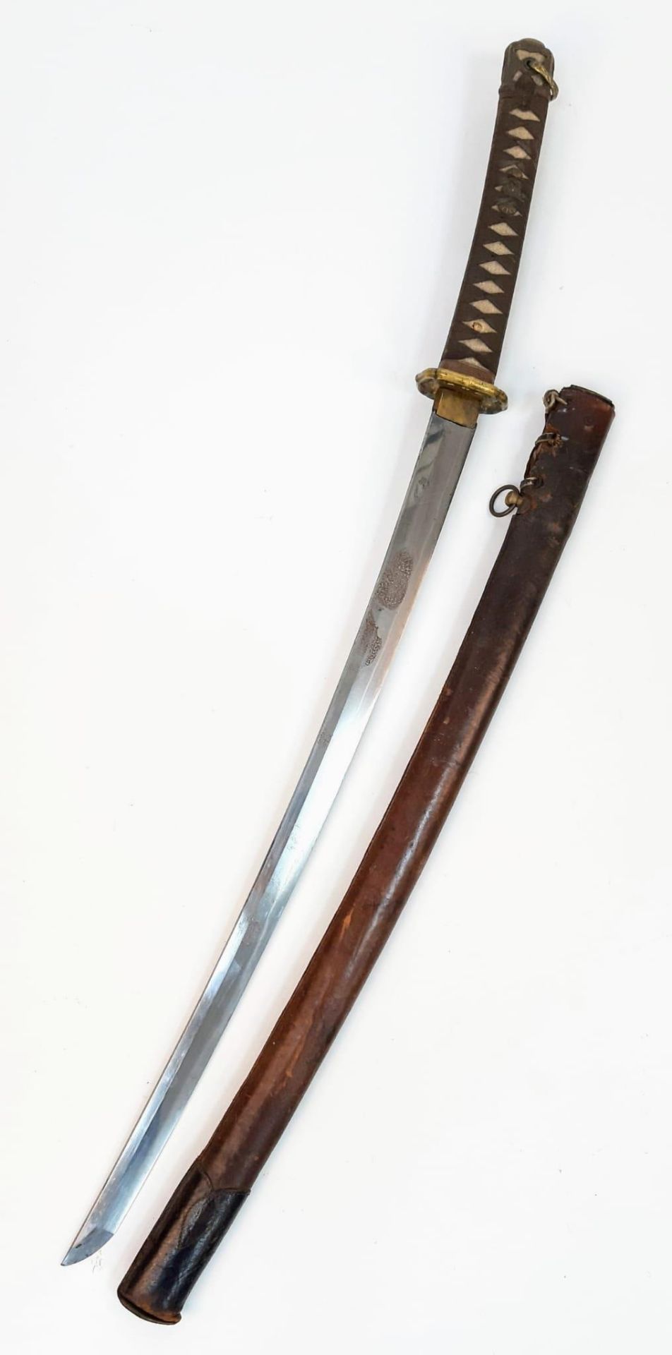 A WW2 Japanese Officers Sword with an ancient family blade. A veteran bring back.