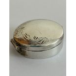 Vintage SILVER PILL BOX in circular form having scroll and foliate border. Lid opens and closes
